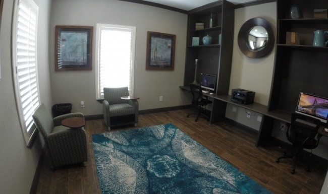 a room with fireplace and a painting on the wall