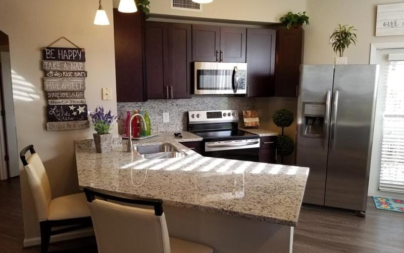 a kitchen with a granite counter top