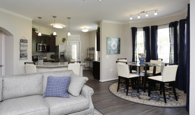 a room with a table and chairs 